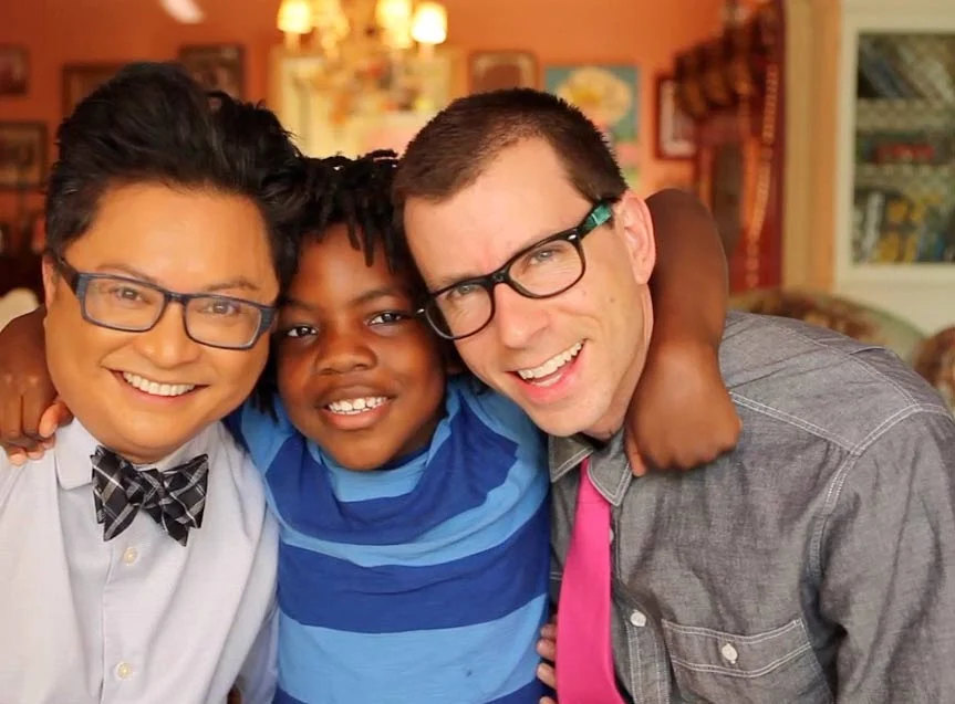 Alec Mapa and Jamison Hebert with their son