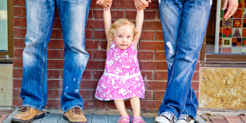 fathers holding their daughters hands