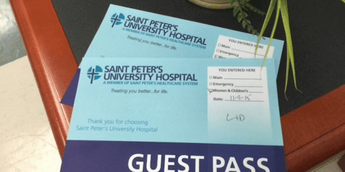 Two hospital guest badges