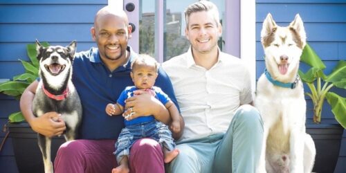 fathers, child and dogs on front porch