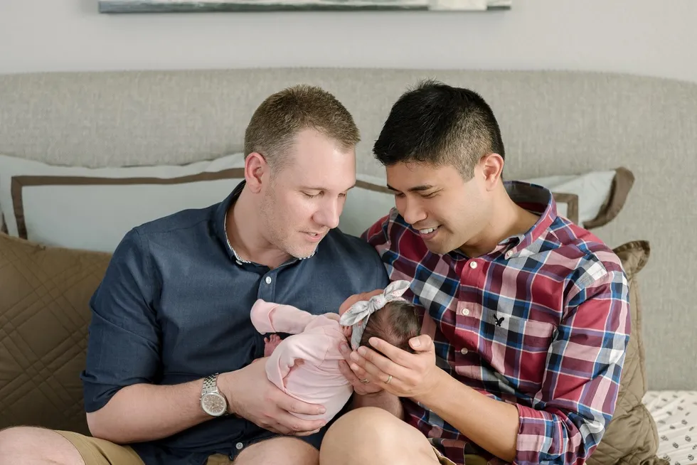 Couple with their newborn daughter