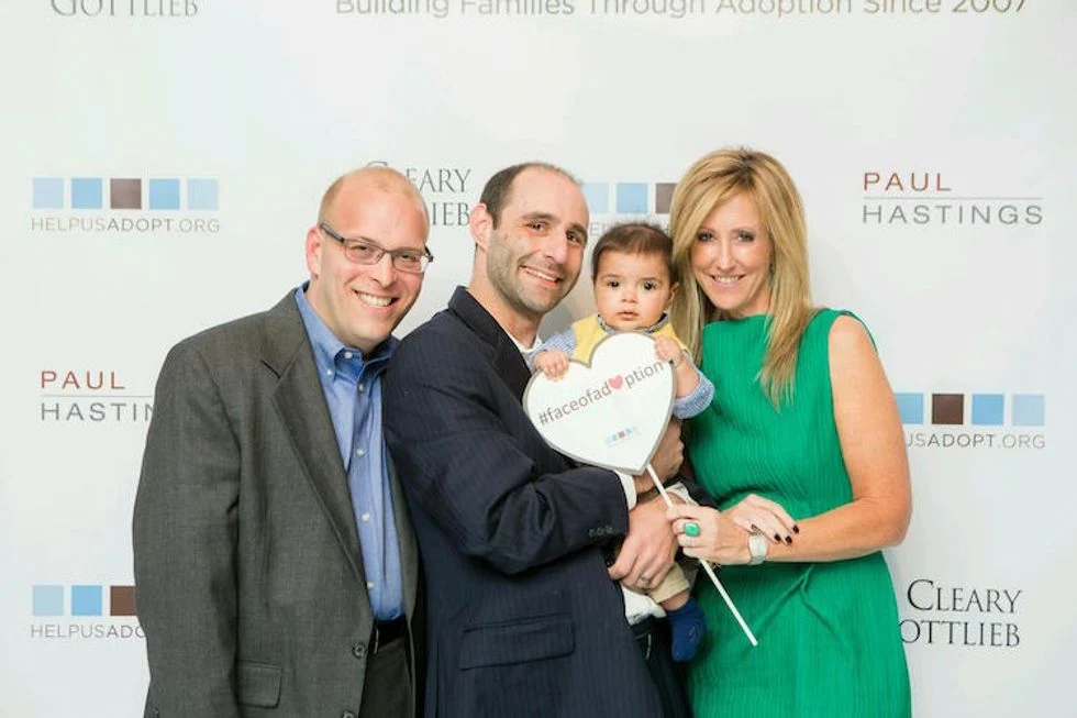 Adoption event.  Fathers with their adopted child.