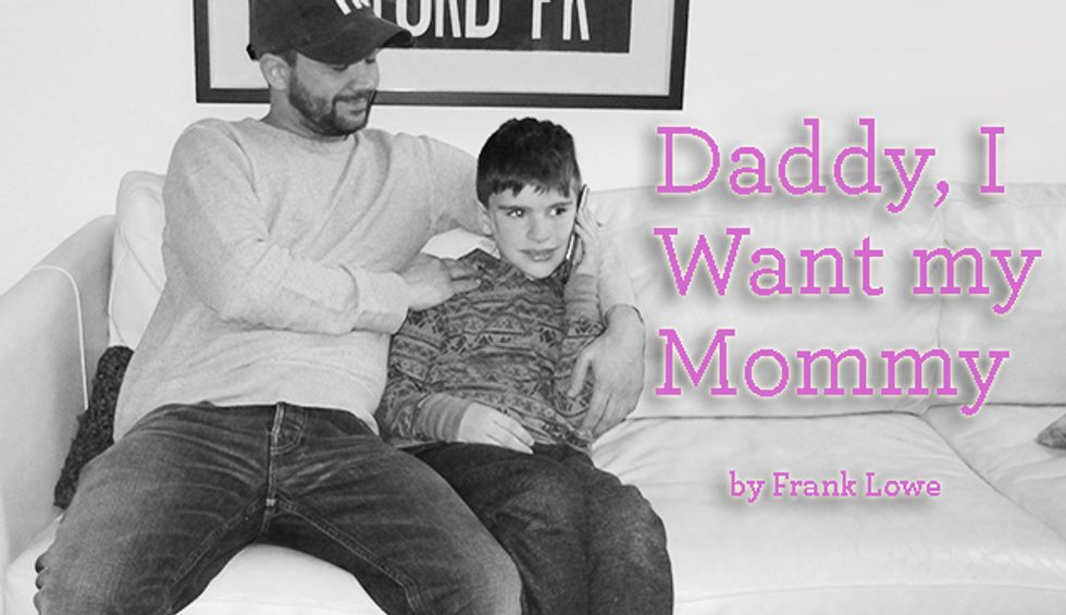 Black and white image of a father and son sitting on a couch with a text overlay saying Daddy, I want my Mommy.