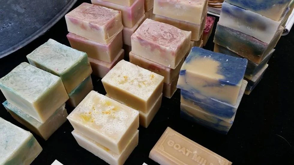 several different colored bars of goat milk soap