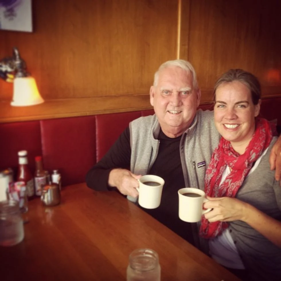 Father and daughter drinking coffee at a restaurant