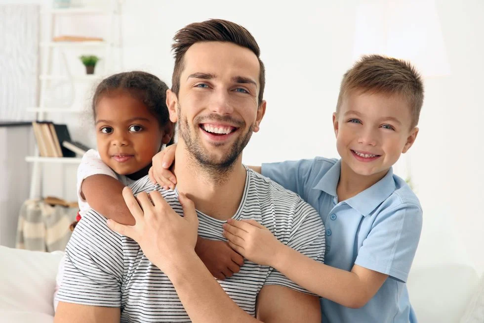 father with son and daughter, interracial family