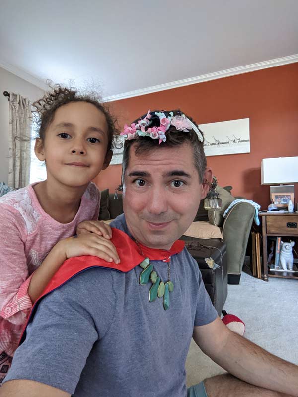 father and daughter playing dress up