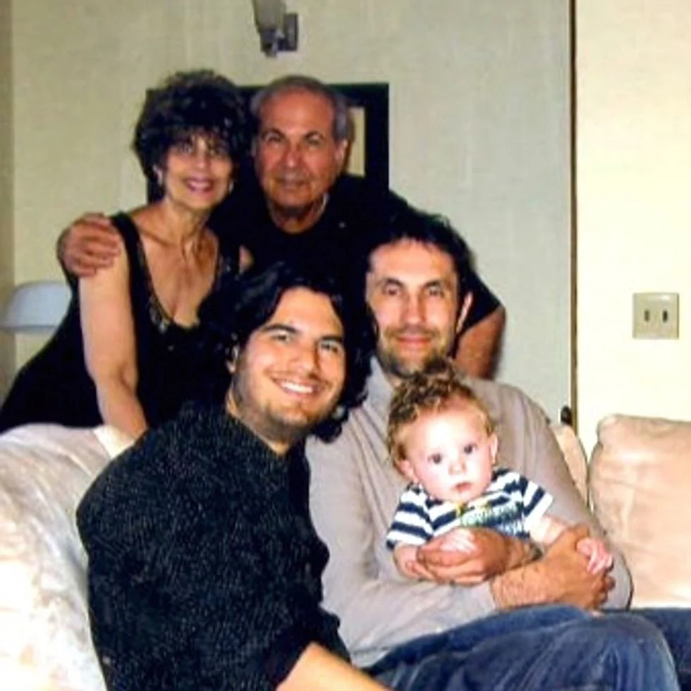 Gay couple with adoption child with parents and grandparents